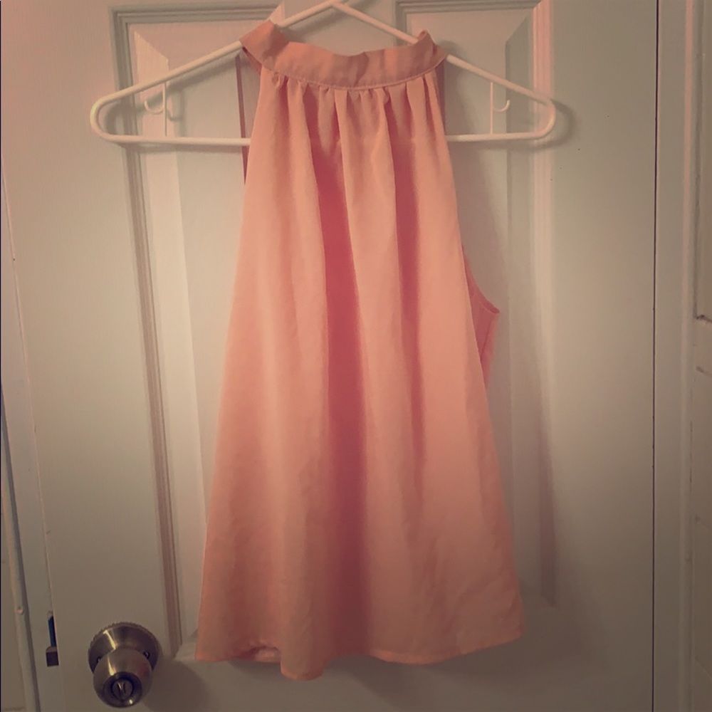 Peach high neck blouse with open back
